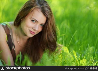 beautiful woman laying on grass
