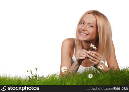 Beautiful woman laying on grass with flowers, isolated on white background