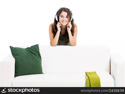 Beautiful woman listen music at home, isolated in white