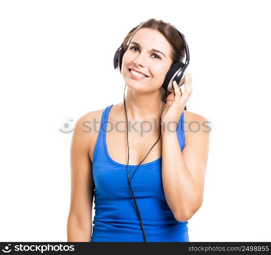 Beautiful woman listen music with headphones, isolated over a white background