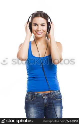 Beautiful woman listen music with headphones, isolated over a white background