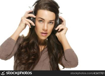 beautiful woman listening to music. beautiful woman listening to music on white background
