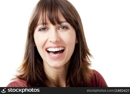 Beautiful woman looking at camera and laughing, isolated on a white background