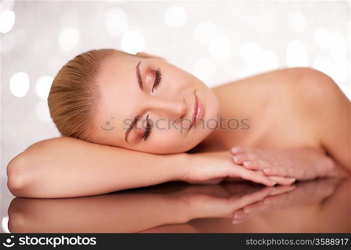 Beautiful woman lying on a table.