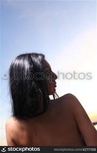 Beautiful woman lying on at the beach