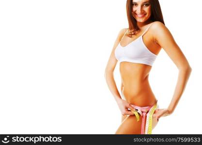 Beautiful woman measuring her perfect shape on white background