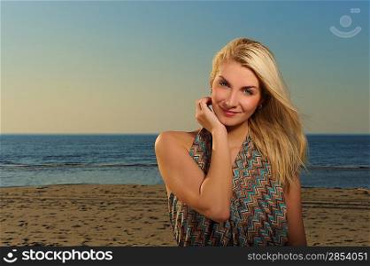 Beautiful woman on a beach at sunset