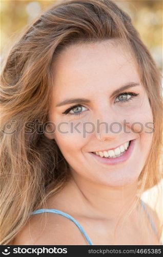 Beautiful woman on a sunny day looking at camera
