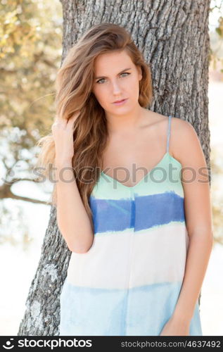 Beautiful woman on a sunny day with the wind blowing her hair