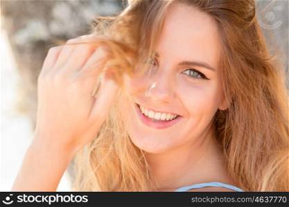 Beautiful woman on a sunny day with the wind blowing her hair