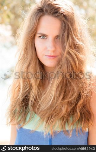 Beautiful woman on a sunny day with the wind blowing her hair