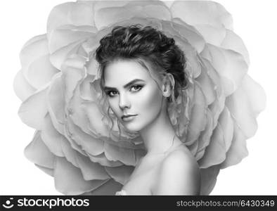 Beautiful woman on the background of a large flower. Beauty summer model girl with peony. Young woman with elegant hairstyle and makeup. Fashion photo