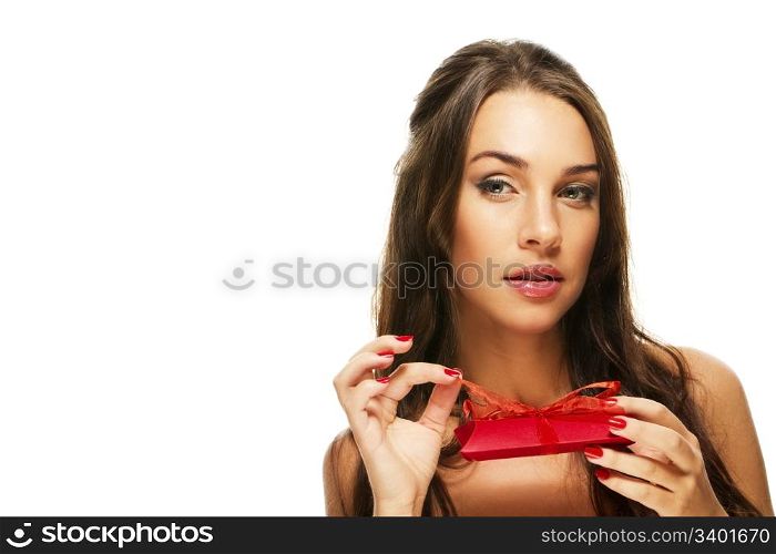beautiful woman opening red present. beautiful woman opening red present on white background