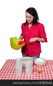 Beautiful woman organizing a checkered picnic table