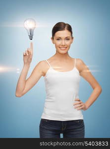 beautiful woman pointing her finger at light bulb