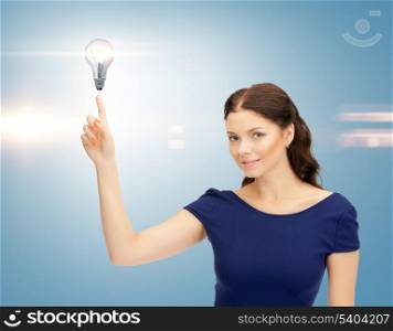 beautiful woman pointing her finger at light bulb
