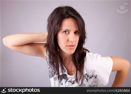 Beautiful woman posing, isolated over grey background