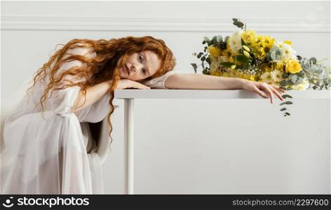 beautiful woman posing with bouquet spring flowers table