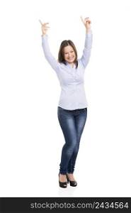 Beautiful woman really happy with both arms on the air, isolated over white background