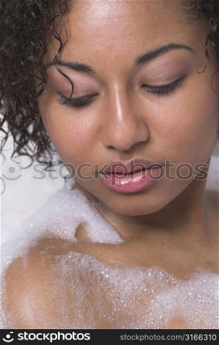 Beautiful woman relaxing in bath