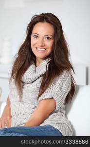 Beautiful woman relaxing on sofa at home