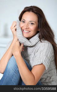 Beautiful woman relaxing on sofa at home