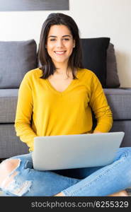 Beautiful woman relaxing with a computer