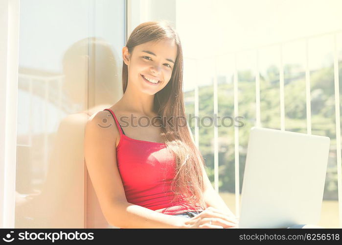 Beautiful woman relaxing with a computer