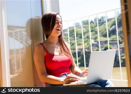 Beautiful woman relaxing with a computer