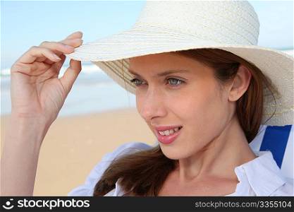 Beautiful woman resting in deckchair at the beach