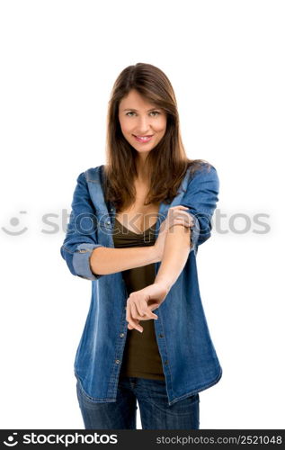 Beautiful woman rolling up her sleeves, isolated over white background. Ready for work