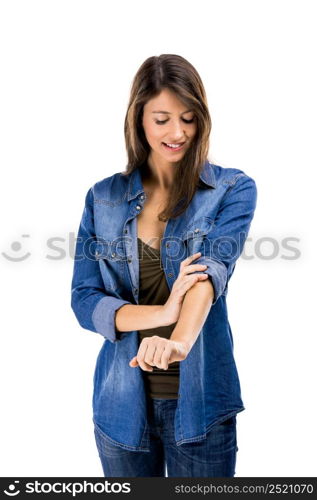 Beautiful woman rolling up her sleeves, isolated over white background. Ready for work