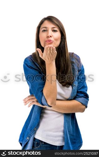 Beautiful woman sending a kiss, isolated over white background. Sending a kiss