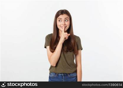 Beautiful woman showing finger over lips isolated on a white background. Beautiful woman showing finger over lips isolated on a white background.