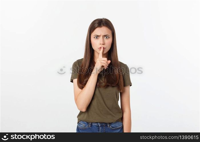 Beautiful woman showing finger over lips isolated on a white background. Beautiful woman showing finger over lips isolated on a white background.