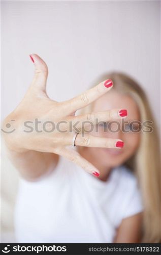 Beautiful woman showing his engagement ring. Selective focus