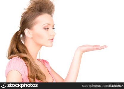 beautiful woman showing something on the palm of her hand