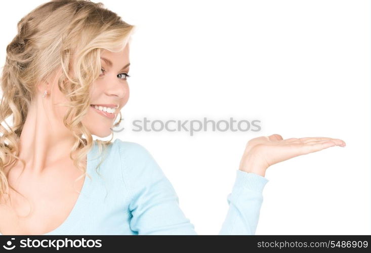 beautiful woman showing something on the palm of her hand