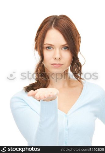 beautiful woman showing something on the palm of her hand.