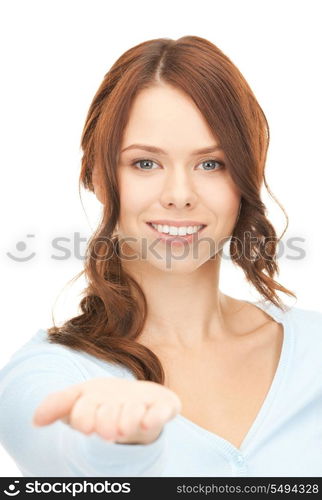 beautiful woman showing something on the palm of her hand.