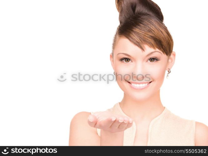 beautiful woman showing something on the palm of her hand