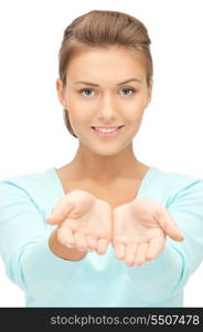 beautiful woman showing something on the palm of her hand