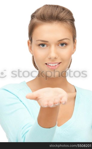 beautiful woman showing something on the palm of her hand