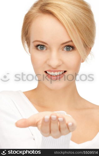 beautiful woman showing something on the palm of her hand