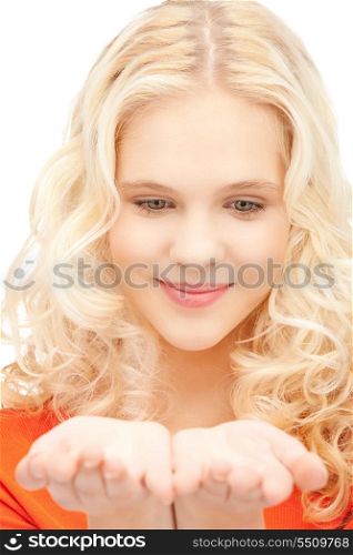 beautiful woman showing something on the palm of her hand