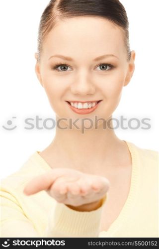 beautiful woman showing something on the palm of her hand&#xA;