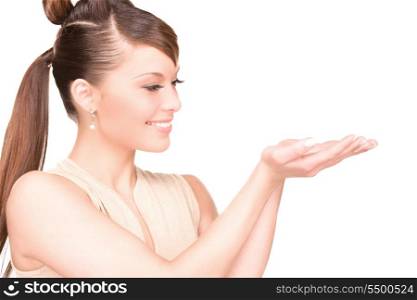 beautiful woman showing something on the palms of her hand