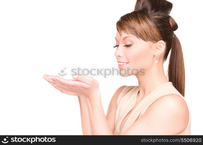 beautiful woman showing something on the palms of her hands