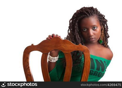 Beautiful woman sitting on a chair, isolated