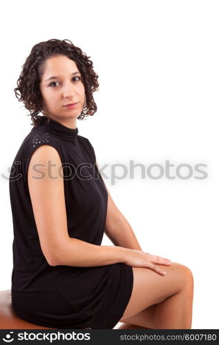 Beautiful woman sitting on a chair, isolated